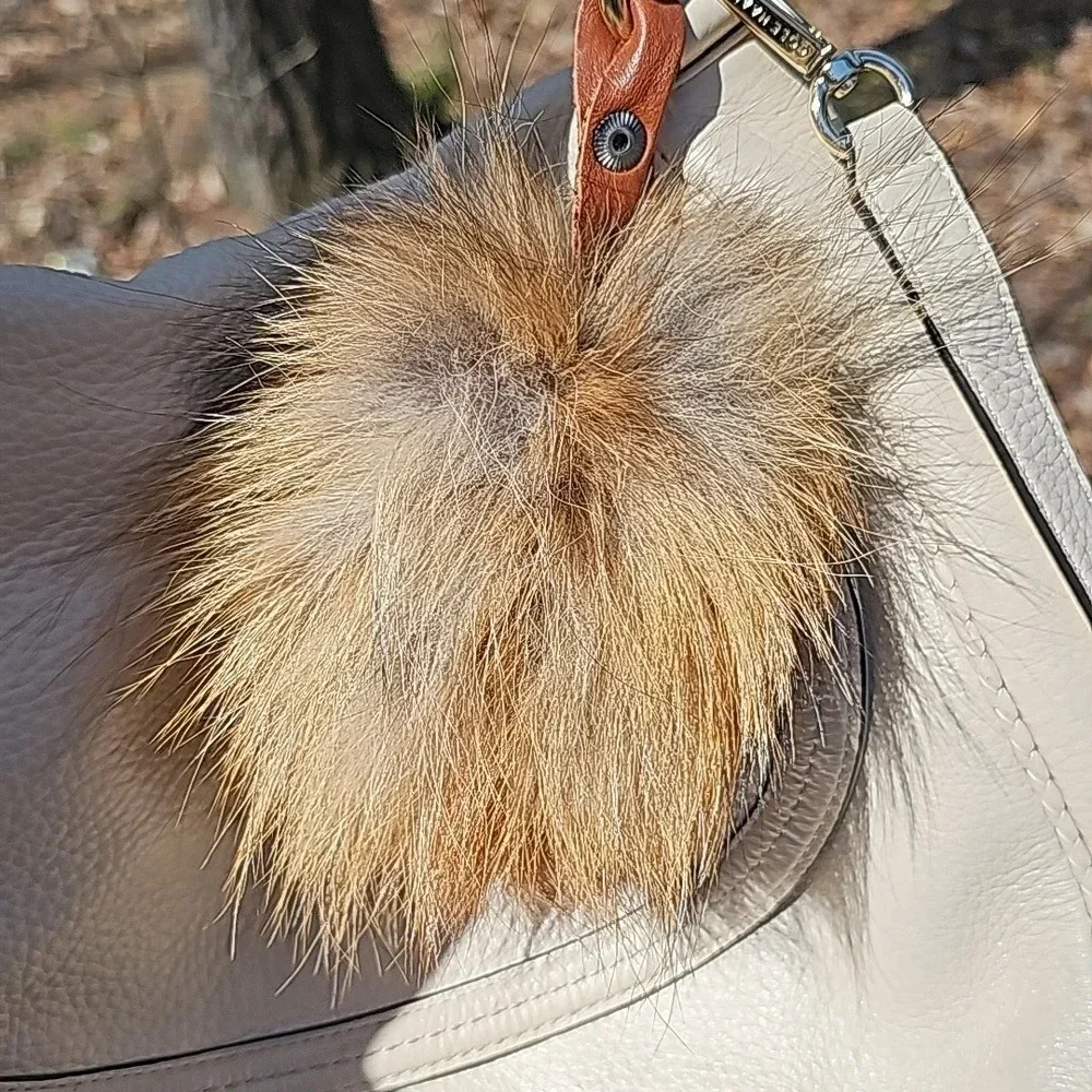 Cole Haan crossbody with fox pom